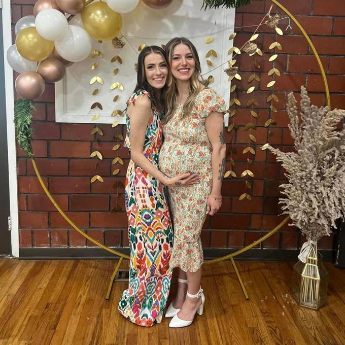 The two sisters behind Brewed Awakening, smiling together